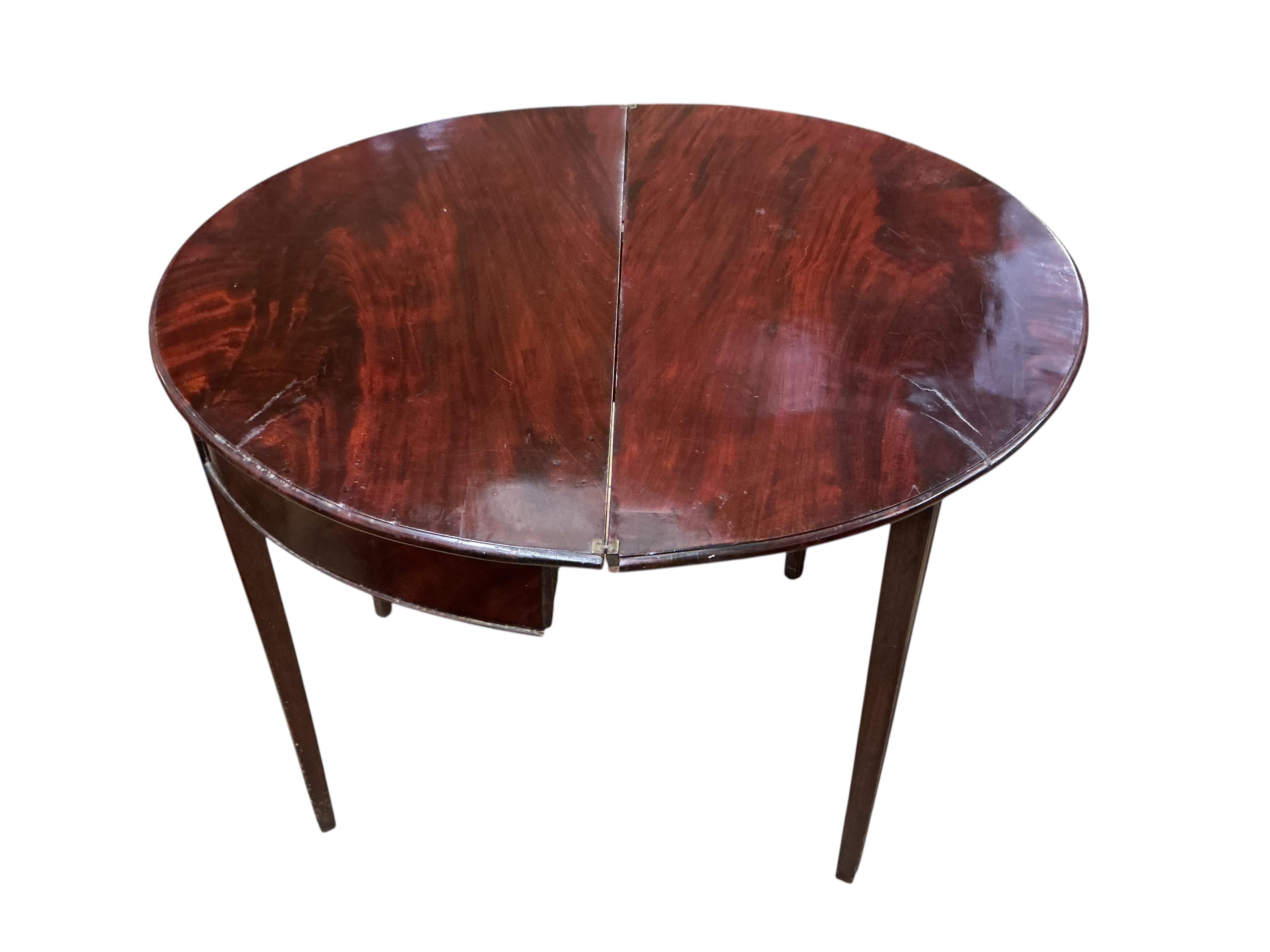 A George III mahogany 'D' shaped folding tea table, width 90cm, depth 44cm, height 72cm